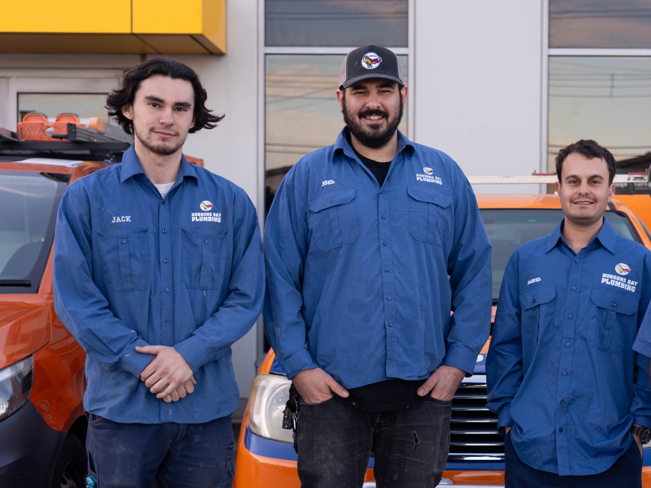 The Hobsons Bay Plumbing team - Jack, Joel and Daniel with the company vans