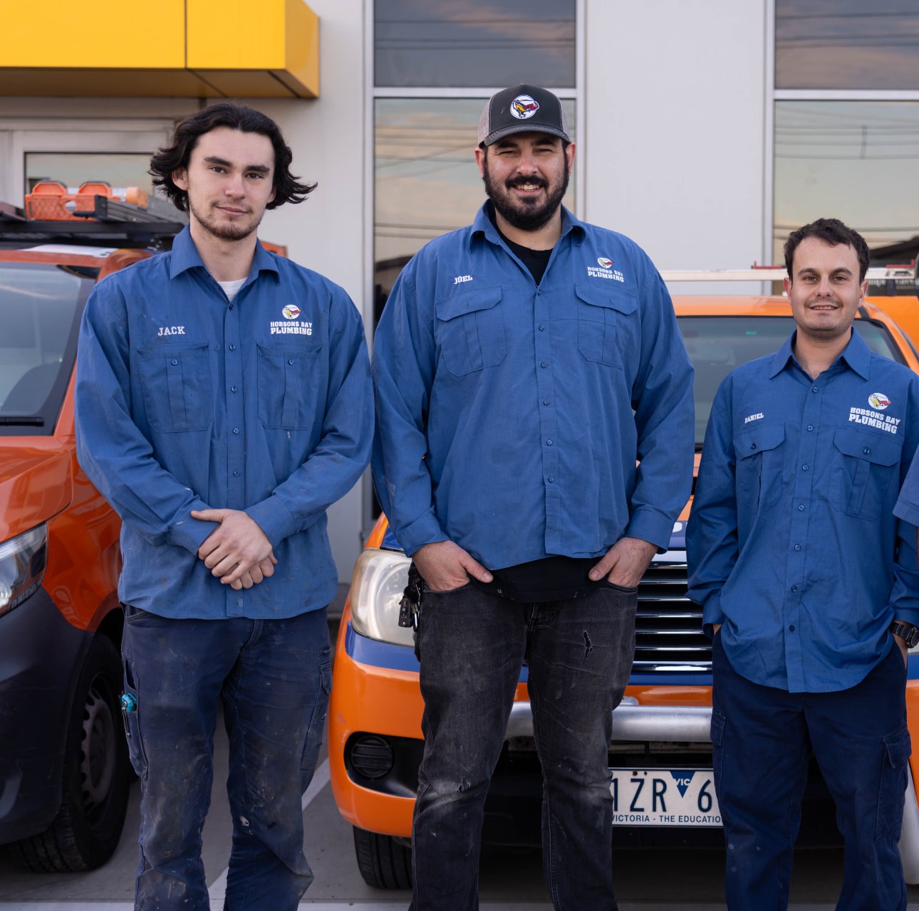 The Hobsons Bay Plumbing team - Jack, Joel and Daniel with the company vans