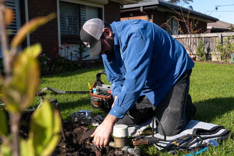 Excavation in a garden to repair underground stormwater drainage