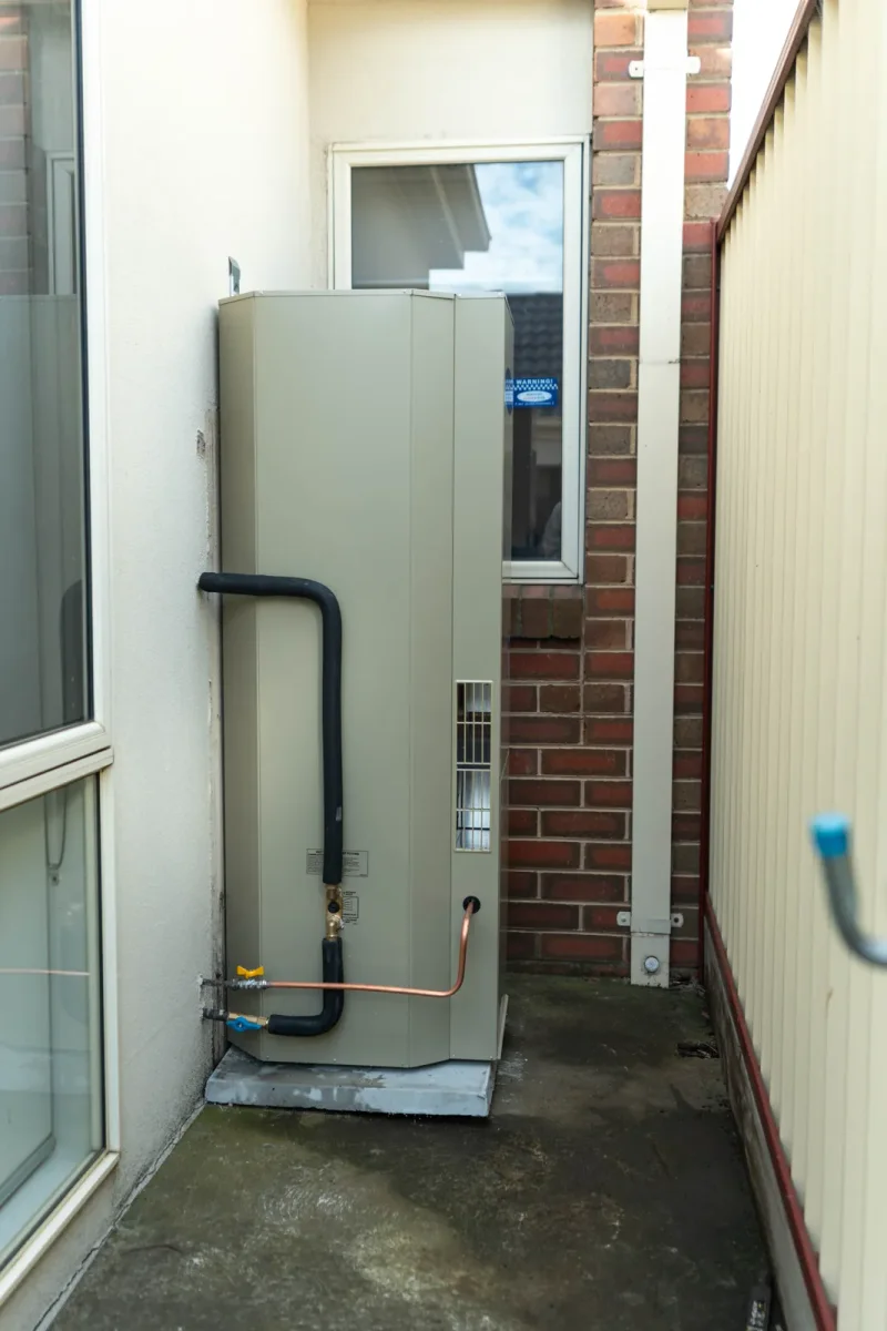 Completed hot water system installation with tidy pipework in Newport